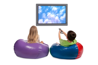 Photo of a young girl and boy watching a large screen television.
